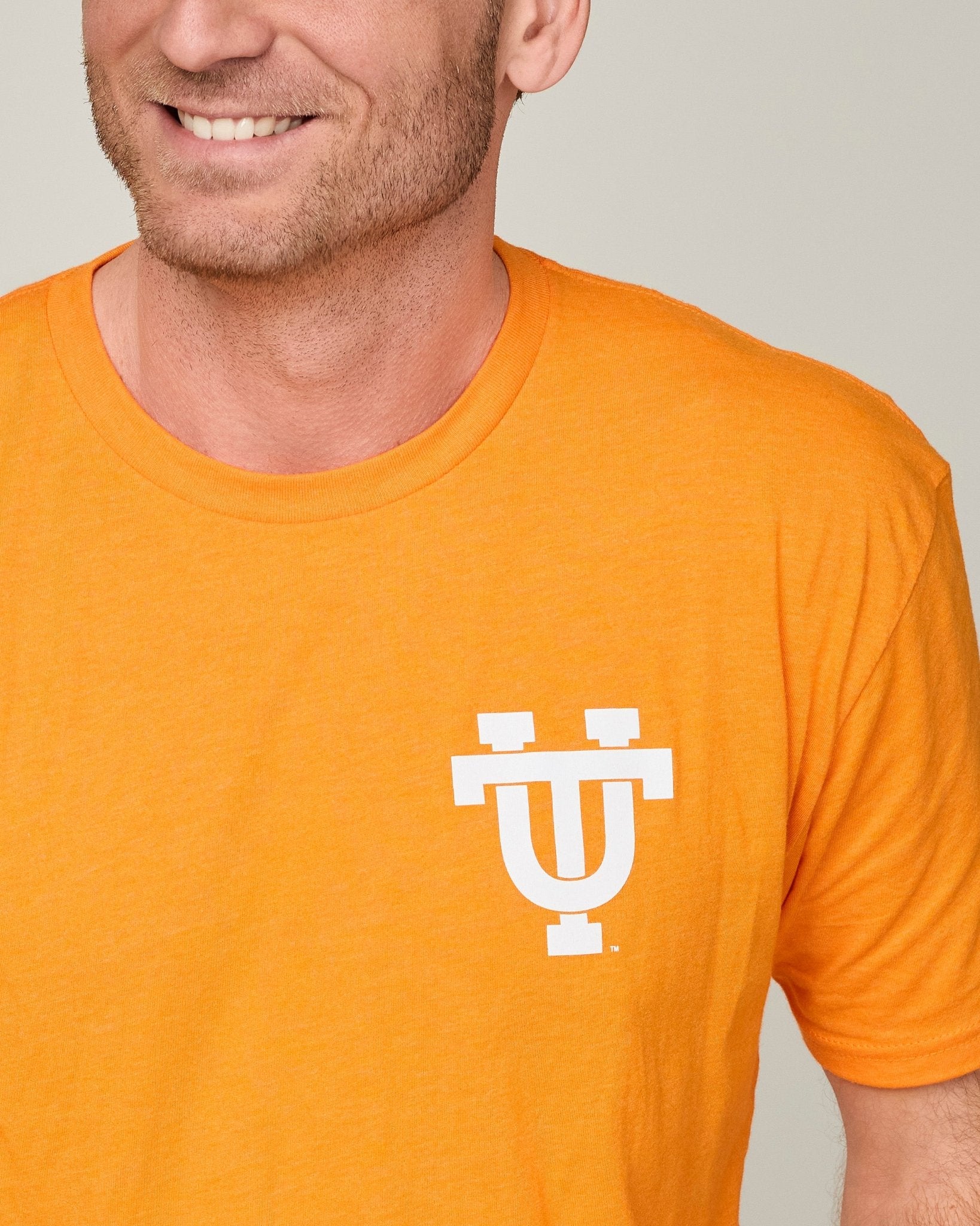 Orange Interlocking UT with Retro Football Player on the Back - The Volunteer Club